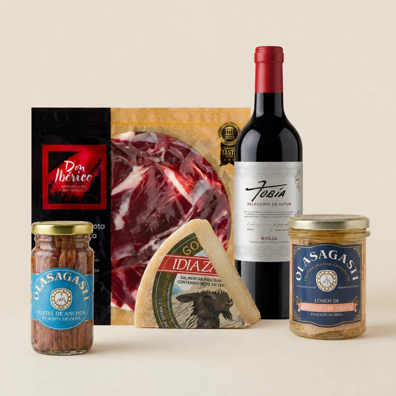 Regalo gourmet Picoteo especial con paleta ibérica, queso Idiazabal, conservas y vino tinto.