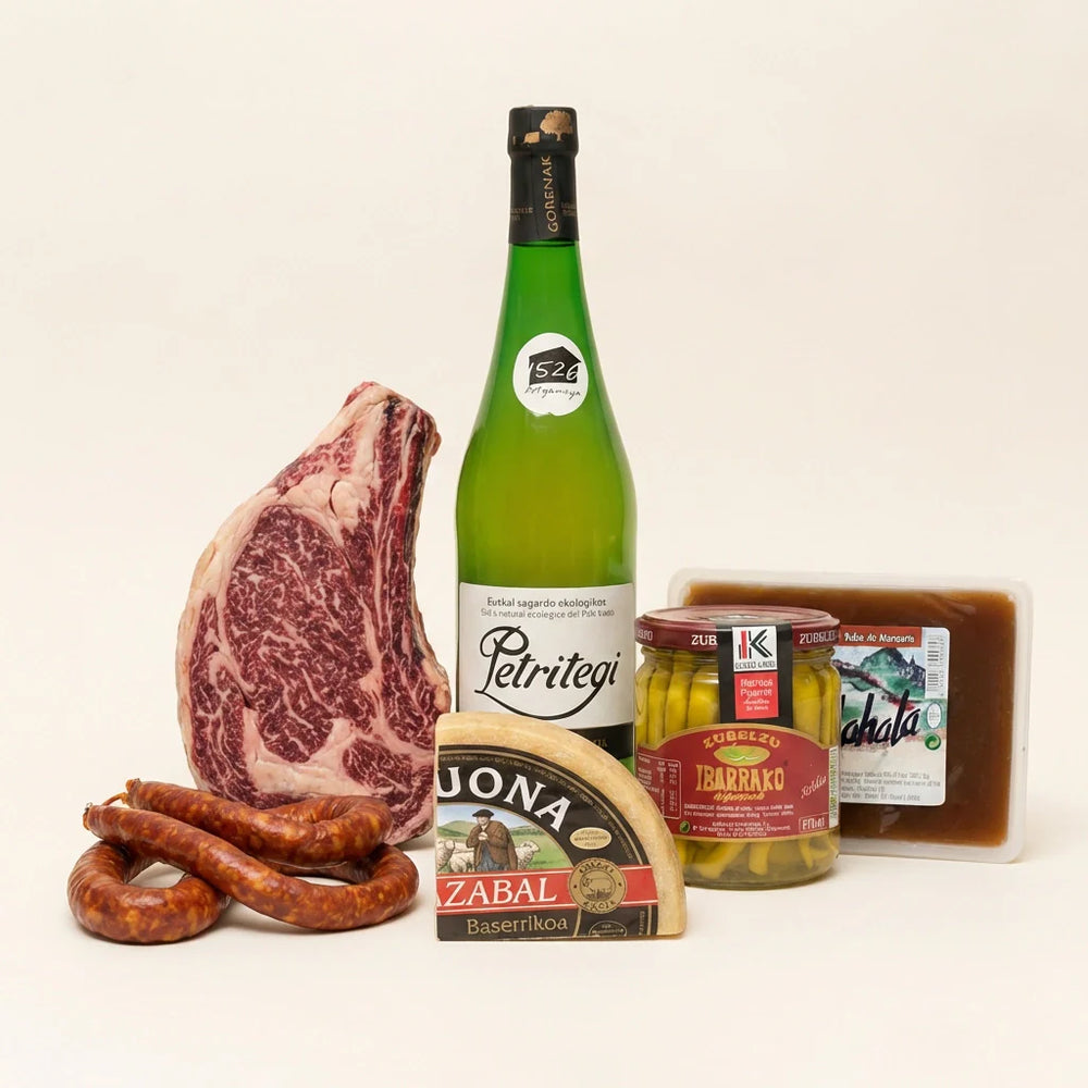 Cesta gourmet vasca con chuletón, sidra natural y queso Idiazabal