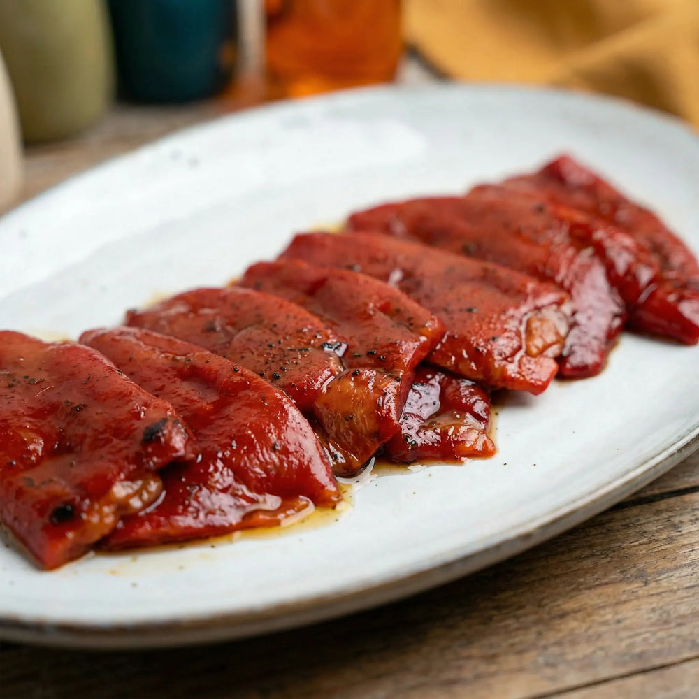 Piquillos extra asados a mano con sabor dulce y textura fina
